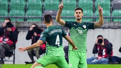 Slovenia's Rok Kronaveter (right) and Miral Samardzic celebrate their winner
