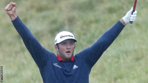 Jon Rahm celebrates after holing his 150-yard shot for an eagle at the fourth