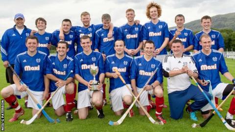 Kyles Athletic pose with the trophy after their victory