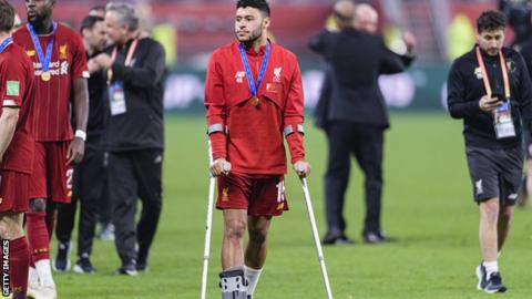 Alex Oxlade-Chamberlain on crutches after the Club World Cup final
