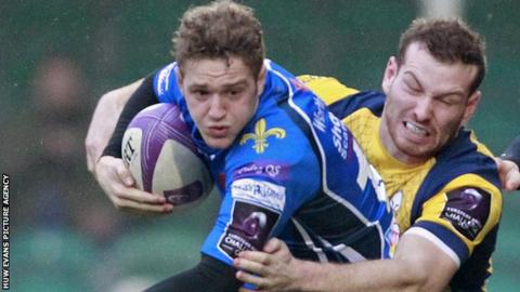 Dragons fly-half Angus O'Brien in action against Worcester
