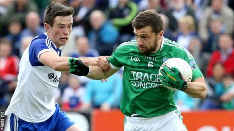Fermanagh's Ryan McCluskey battles with Monaghan's Shane Carey in the first half at Breffni Park