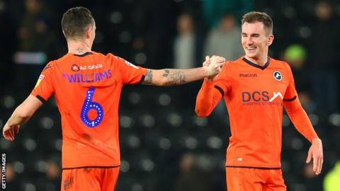 Shaun Williams and Jed Wallace celebrate the latter's goal against Derby County