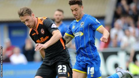 Newport's Alex Rodman is challenged by David Fitzpatrick
