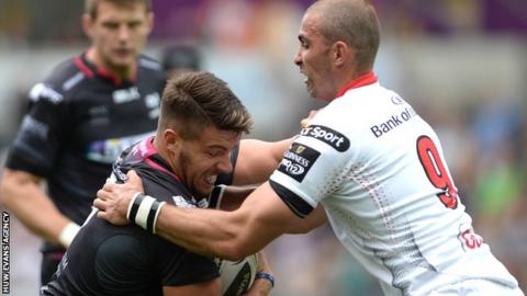 Ospreys' Rhys Webb grapples with Ulster scrum-half Ruan Pienaar