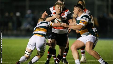 Matthew Jones of Pontypool tests the Merthyr defence