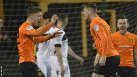 Carrick Rangers celebrate Daniel Kelly's opening goal against Crusaders