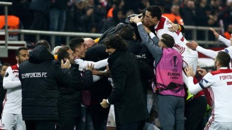 Olympiakos players celebrate