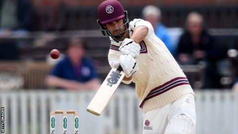 Somerset's Lewis Gregory plays a shot