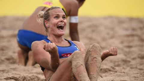 Tokyo, Japan, 28 July: Taru Lahti-Liukkonen of Finland celebrates her victory with Anniina Parkkinen in their FIVB Beach Volleyball World Tour match with Yui Nagata and Minori Kumada of Japan. (Photo by Matt Roberts/Getty Images)