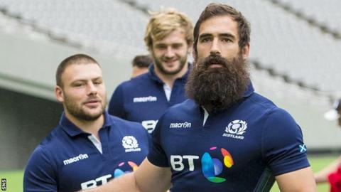 Josh Strauss limbers up in Scotland training at the Tokyo Stadium on Friday