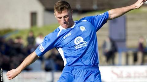 Chris Mitchell in action for Queen of the South