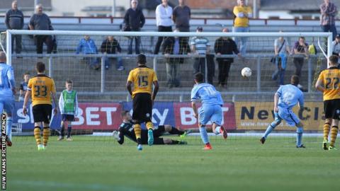 Paul Mullin sends Newport goalkeeper Joe Day the wrong way from the spot