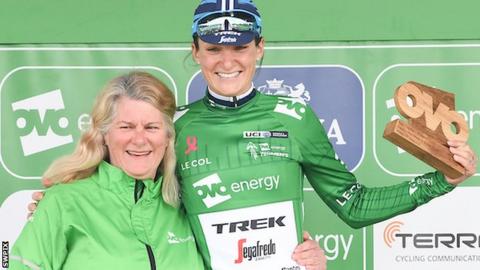 Lizzie Deignan celebrates her leader's jersey