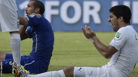 Italy Giorgio Chiellini and Uruguay's Luis Suarez