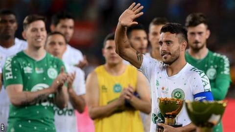 Chapecoense defender Alan Ruschel, who survived the plane crash which killed many of his team-mates, waves to the crowd at the Nou Camp