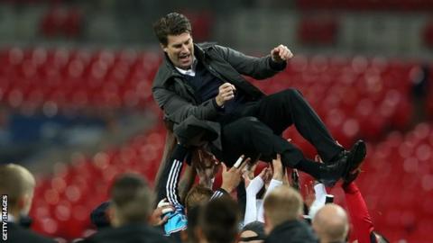 Michael Laudrup is thrown in the air by Swansea City players after the 2013 League Cup final