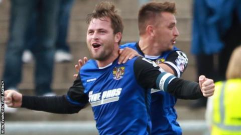 Stevenage defender Mark Hughes celebrates his late equaliser against Newport