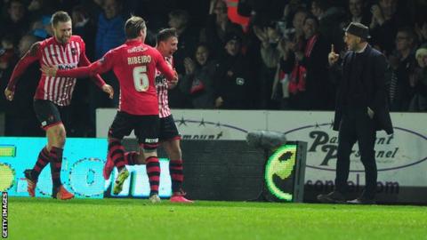 Paul Tisdale reacts to Lee Holmes after he put Exeter 2-1 up against Liverpool at St James Park