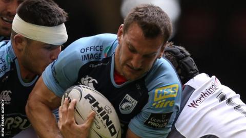 Sam Warburton is tackled by Ospreys prop Nicky Smith