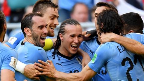 Uruguay celebrate after scoring their second goal against Russia
