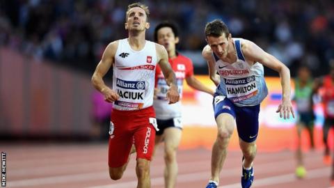 Hamilton stretches for the line just behind Sylwester Jaciuk of Poland.