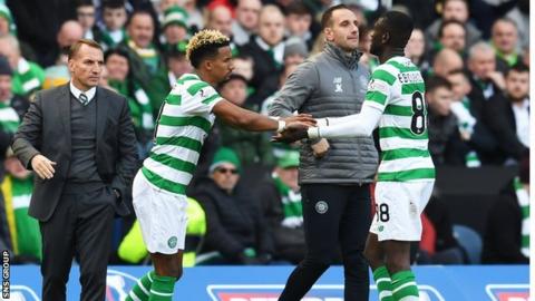 Eboue Kouassi (right) was replaced by Scott Sinclair after injuring his knee against Hearts in the League Cup