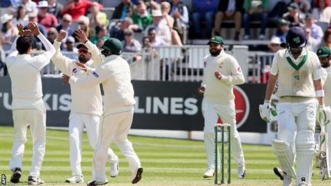 Pakistan celebrate as Ireland batsman Andrew Balbirnie walks off after his dismissal