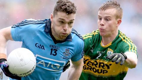 Paddy Andrews of Dublin in action against Kerry defender Fionn Fitzgerald