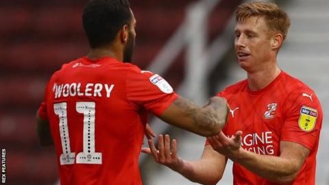 Eoin Doyle celebrates a Swindon Town goal