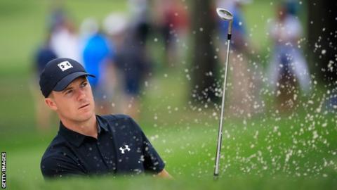Jordan Spieth plays a shot out of a bunker