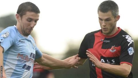 Ballymena's Gary Thompson in action against Crusaders defender Craig McClean