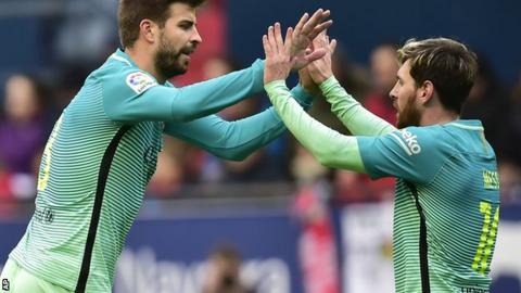 Gerard Pique and Lionel Messi