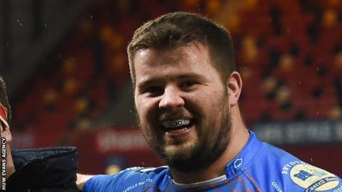 Nicky Thomas smiles in celebration