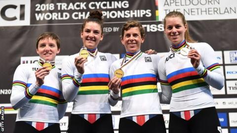 USA women's team pursuit squad (from left to right) Kelly Catlin, Chloe Dygert Owen, Kimberly Geist and Jennifer Valente hold up their gold medals after victory at the 2018 World Championships