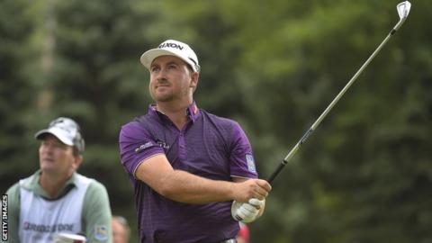 McDowell watches his tee shot at the sixth hole on Saturday