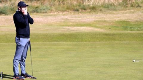 Agony for Rory McIlroy on the greens as he fails to find the hole at the 18th in the second round
