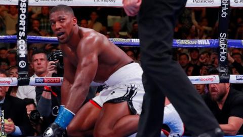 Anthony Joshua on his knees after being knocked down by Andy Ruiz Jr