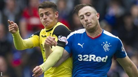 Livingston's Danny Mullen challenges Rangers' Danny Wilson
