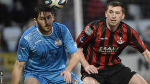 Portadown's Sean Mackle and Crusaders defender BJ Burns battle for possession