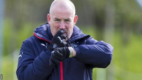 Mark Warburton blows a whistle as he takes Rangers training