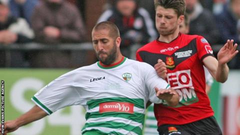 Phil Baker (left) in action against Newtown