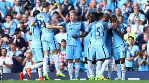 Manchester City players celebrate scoring
