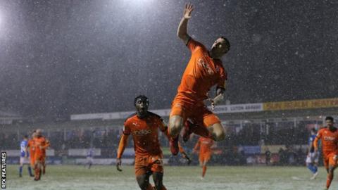 James Collins celebrates a Luton goal