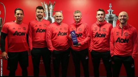 Man Utd manager Ole Gunnar Solskjaer (third from right) and his coaching team