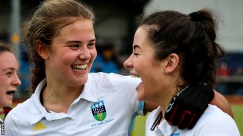 UCD players celebrate their Irish Cup final success over Pegasus
