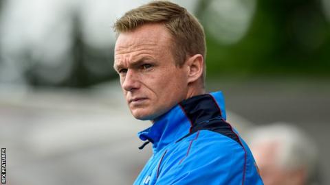 Wrexham boss Dean Keates watches his side play