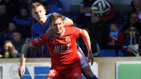 Glenavon's Ciaran Martyn challenges Portadown's Gary Twigg