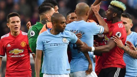 Manchester United and Manchester City players clash during United's 3-2 win at Etihad Stadium on Saturday