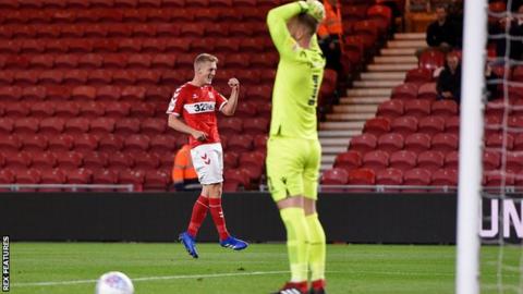 George Saville celebrates his first-half goal against Bolton